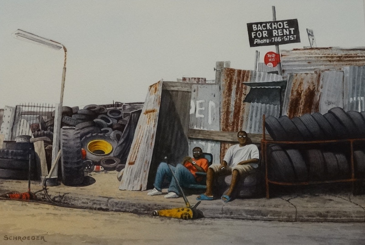 Two men sitting outside a junkyard, selling tires